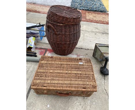A WICKER LAUNDRY BASKET AND A WICK HAMPER BASKET 
