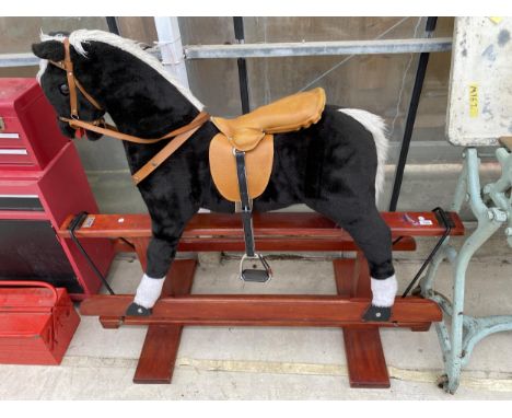 A VINTAGE CHILDS ROCKING HORSE 