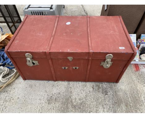 A LARGE WOODEN STORAGE TRUNK 