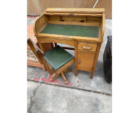 A VINTAGE ROLL-TOP CHILDS DESK AND SWIVEL CHAIR WITH BOX SEAT, THE CHAIR BEARS 'TAYLORS, MADE IN LEICESTER' LABEL 