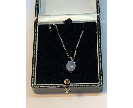 A SILVER NECKLACE WITH A PALE BLUE OPAL STYLE PENDANT IN A PRESENTATION BOX 