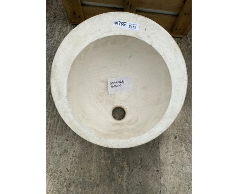 A SOLID MARBLE WASH BASIN 