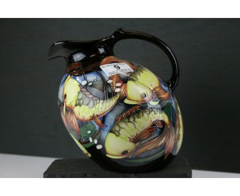 Moorcroft Pitcher / Jug with tube-lined decoration of fish amongst bullrushes limited edition no. 42/75, dated 2012, signed t