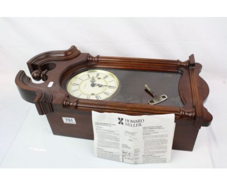 A Howard Miller Westminster chime mahogany cased wall clock.