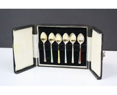 A cased set of six fully hallmarked sterling silver and enamel coffee spoons.