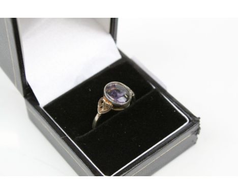 A 925 sterling silver ring with Blue John cabochon centre stone.