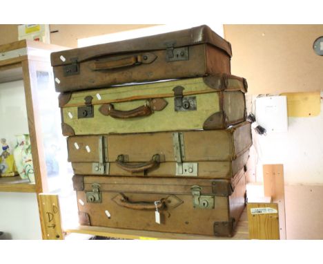 Three Vintage Leather Suitcases together with a Canvas Suitcase