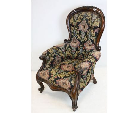 Victorian Spoon and Button Back Armchair with Floral and Scroll Carving to Top Rail and Arms, upholstered in dark floral fabr