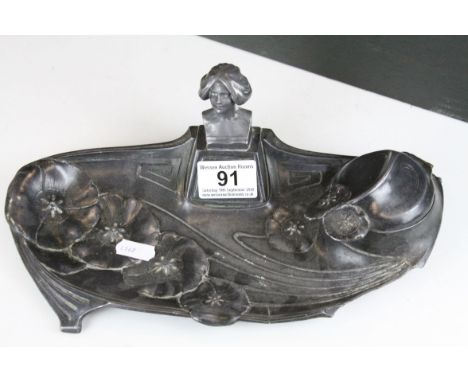 Art Nouveau Pewter Standish with a single inkwell compartment and applied Maiden's Head, 29cms long