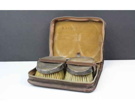 A pair of fully hallmarked sterling silver brushes with engine turned decoration in original brown leather fitted case, assay