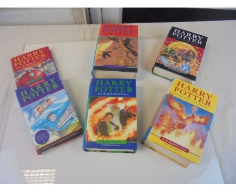 Six J K Rowling Hardback Harry Potter Books with dust jackets including The Philosopher's Stone, Chamber of Secrets, Goblet o