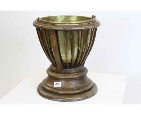 Early 20th century Plant Holder, the slatted sides holding a brass liner, the liner lifting to reveal a plaque reading ' This
