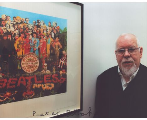 Beatles Peter Blake signed 10 x 8 photo with him standing by the Sgt Pepper Lonely Hearts Club painting. Good condition. All 