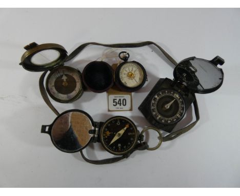 Three various military compasses, two in brass cases together with a pocket barometer in its original leather carrying case 