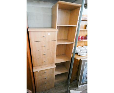 A pair of light pine effect four drawer bedside chests and a tall open bookshelf 