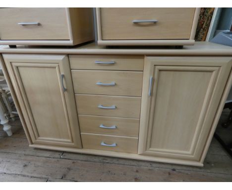 A modern light beech sideboard fitted five centre drawers and cupboards (no shelves), 4'6 wide 