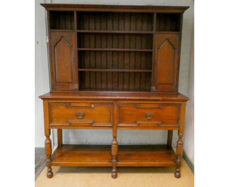 An antique style oak dresser with shelf and cupboard back standing on a base fitted two deep drawers with pot rack under, 5' 
