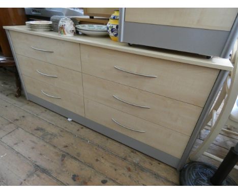 A modern light beech long low chest fitted six drawers with stainless steel handles 5'6 wide 