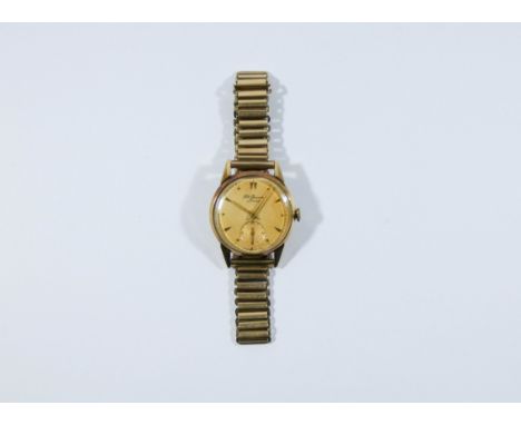 Vintage gentleman's 9ct gold Benson wristwatch, on 9ct gold strap.  watch ticks when wound. 48 grams all in 