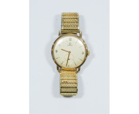 A vintage gents 9ct yellow gold Omega wrist watch with a metal expanding strap, mechanical movement 