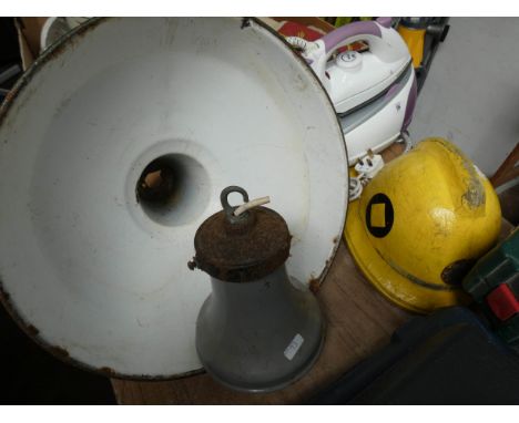 Two old ceramic light fittings and an old fireman's helmet 