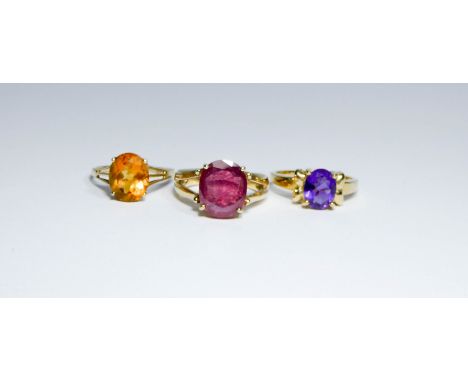 Three modern 9ct gold ladies single stone dress rings - amethyst, citrine and ruby, all ring size N