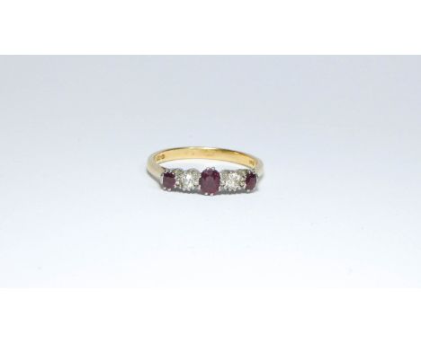 An 18ct gold ruby and diamond five stone ring, ring size T, approximate weight 3.9g