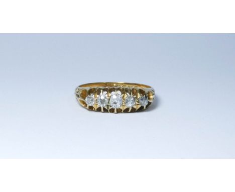 An five stone diamond ring set in 18ct yellow gold, with floral motifs on shoulders, ring size R 1/2, approximate weight 4.4g