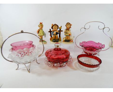 Three Hummel figurines of children and five pieces of cranberry and other glass 