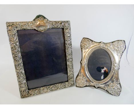Two hallmarked silver easel photograph frames, the tallest of which measures 29cm 