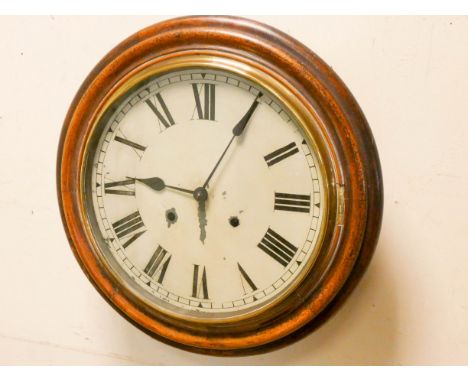A Victorian mahogany circular school type wall clock with striking movement, approximately 12" diameter  