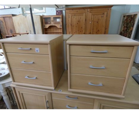 A pair of light beech three drawer bedside chests matching the previous sideboard 