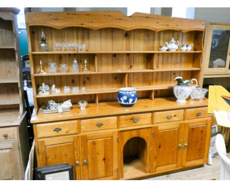 Pine kitchen dresser with open shelf back, five drawers and four cupboards under with a dog kennel style centre piece, 7' wid