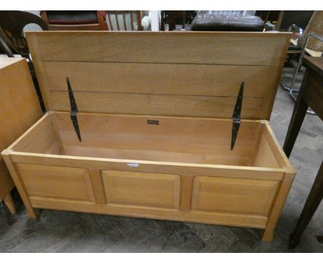 A Reynolds of Ludlow good quality light oak blanket chest or coffer with three panel front, 49" wide 