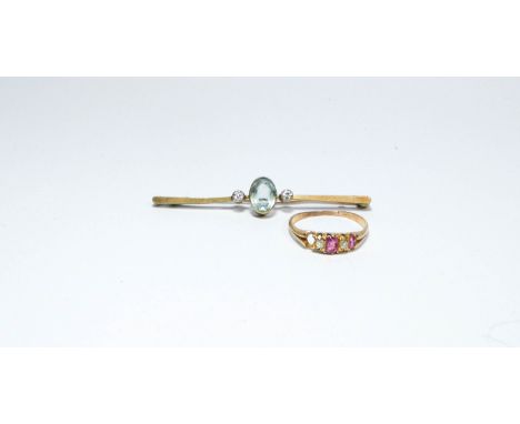 A five stone ruby and diamond ring (one ruby missing) and an aquamarine and diamond brooch set in 15ct yellow gold