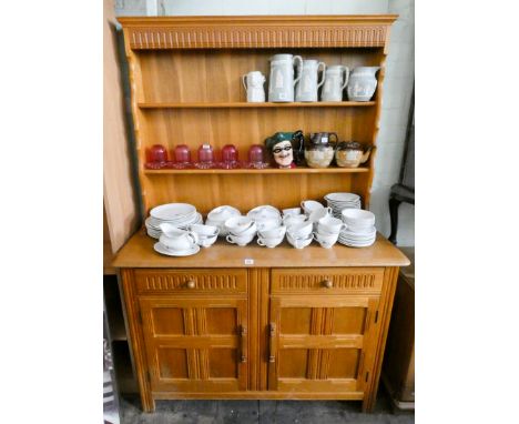 A light oak welsh style dresser with shelf back and drawers and cupboards under, 4' wide 