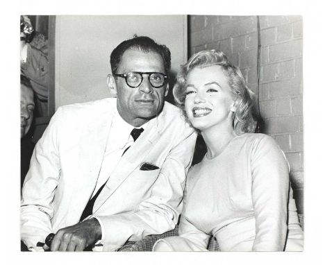 MARILYN MONROEa photographic gelatin silver print of Marilyn Monroe and Arthur Miller, taken during their visit to London in 