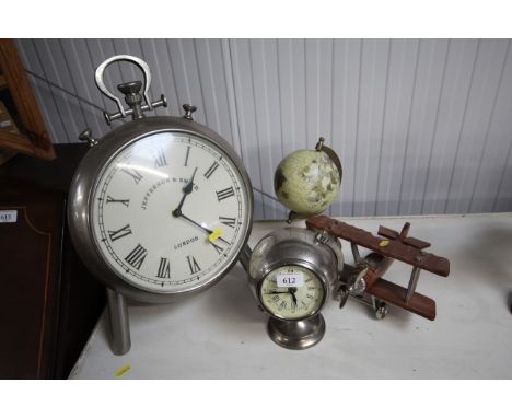 A desk globe, wooden and metal biplane, easel clock in the form pocket watch etc