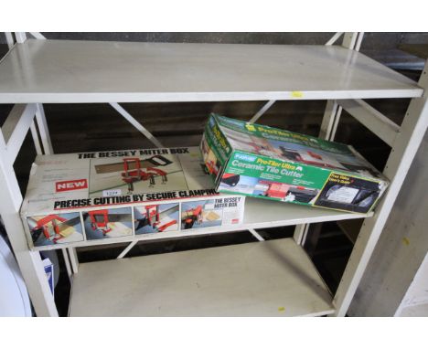 A Bessey mitre box in original box together with a Plasplugs ceramic tile cutter in original box