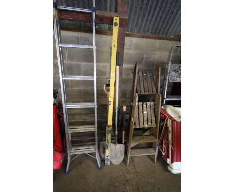 A quantity of construction tools to include shovels, sledgehammer, two builders levels
