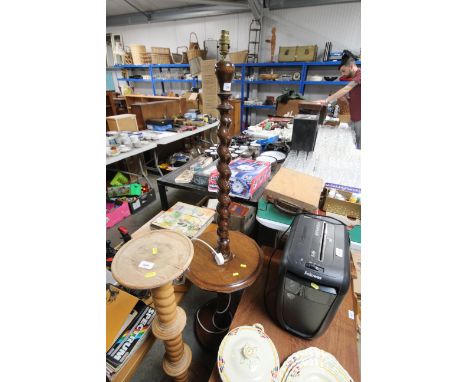 An oak standard lamp lacking shade