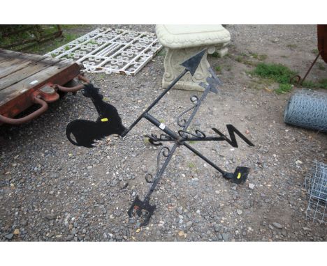 A weather vane with rooster decoration