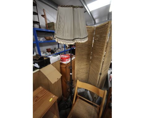 A wrought iron adjustable lamp converted to electricity