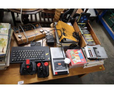 A ZX Spectrum 48 with various games, magazines and a Hanimex Model 7771 electronic TV game