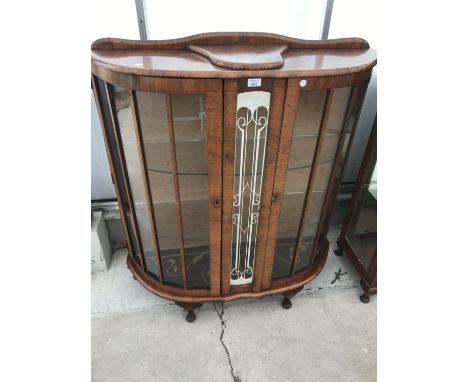 A MAHOGANY BOW FRONT CHINA CABINET ON CABRIOLE SUPPORTS WITH TWO GLAZED PANEL DOORS 