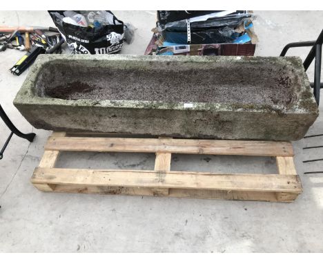 A LARGE STONE TROUGH 133CM X 36CM 