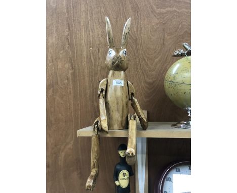 A WOODEN SHELF PUPPET RABBIT MODEL 