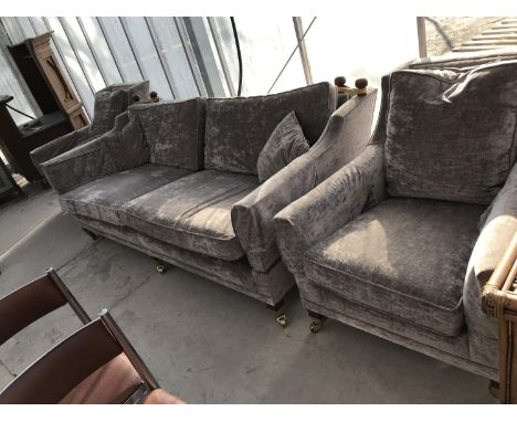 A KNOLE STYLE TWO SEATER SOFA AND TWO ARMCHAIRS ON BRASS CASTERS 