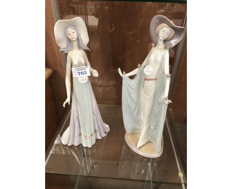 A PAIR OF BOXED 'LLADRO' TALL CERAMIC LADY FIGURES 