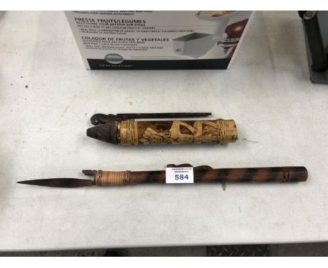 AN UNUSUAL BLOW DART PIPE AND HOLDER 